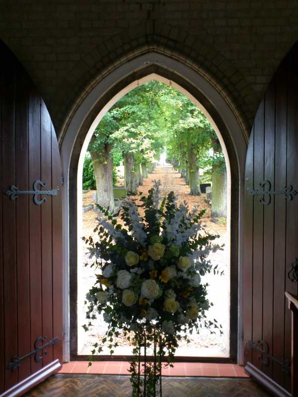 Flowers framed in the cemetery chapel doors